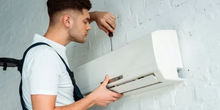 depositphotos_328088680-stock-photo-handsome-installer-holding-screwdriver-while